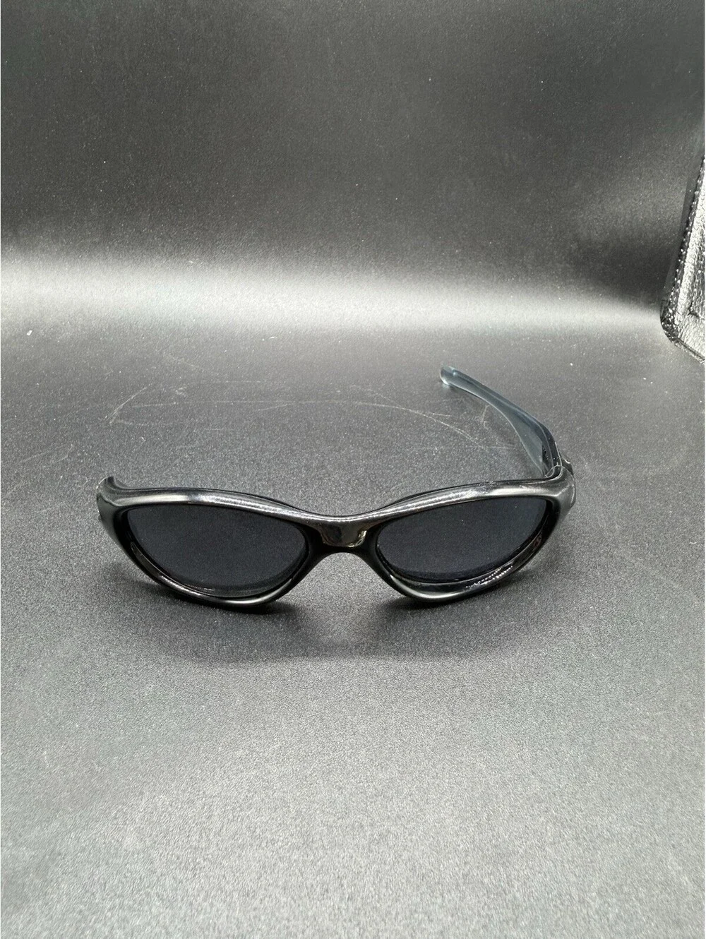 Oakley Pocket Polished Black/Black Iridium Lenses (Missing Right Arm)